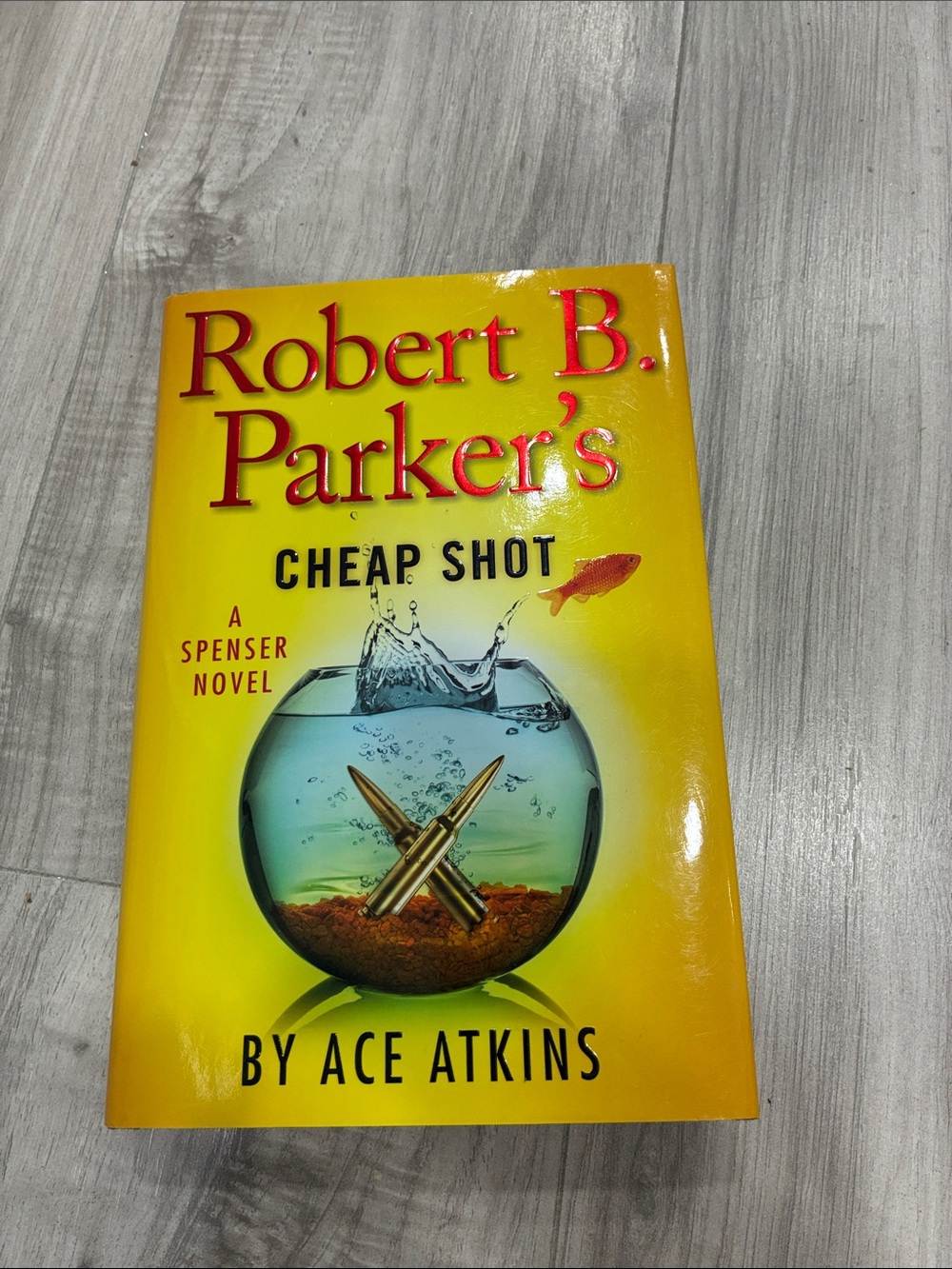Robert B. Parker's Cheap Shot by Ace Atkins - Yellow Cover